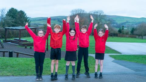 5 pupils wearing different items of school uniform